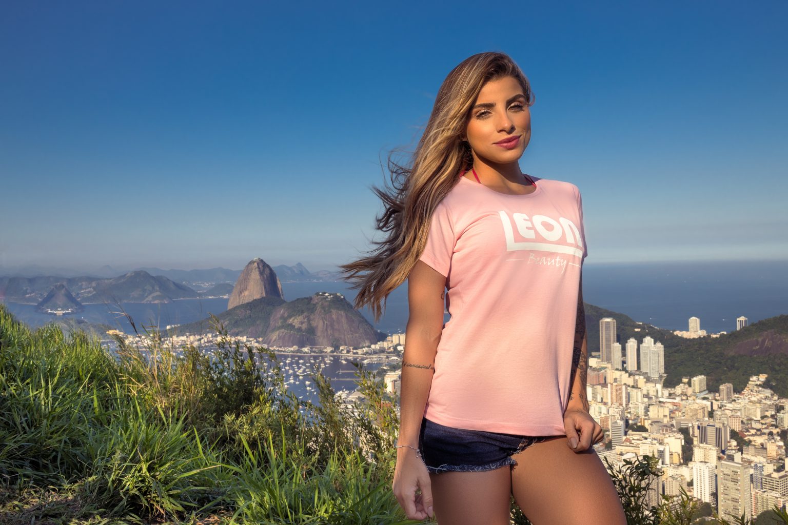 Model in a Leon Beauty T-shirt overlooking Sugarloaf Mountain in Rio de Janeiro