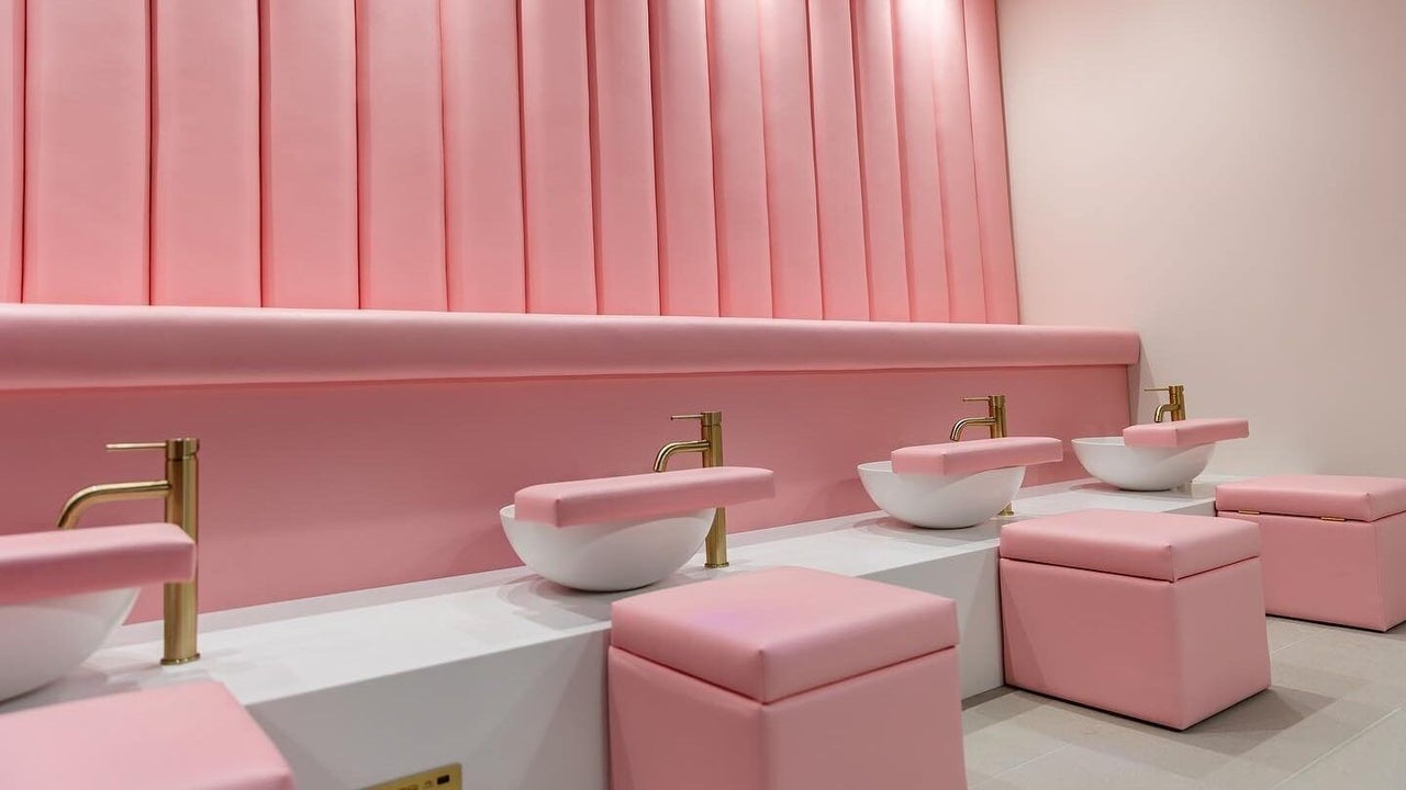 Pedicure lounge with pink panelled wall